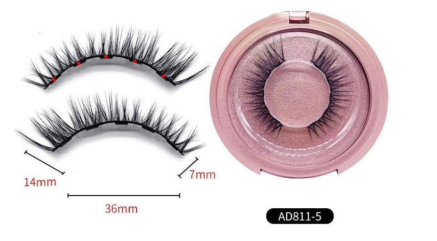 False eyelashes with measurements and a pink case on a white background