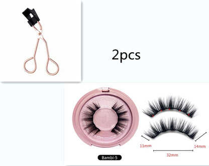 Set of false eyelashes with a pink case and a pair of tweezers on a white background.