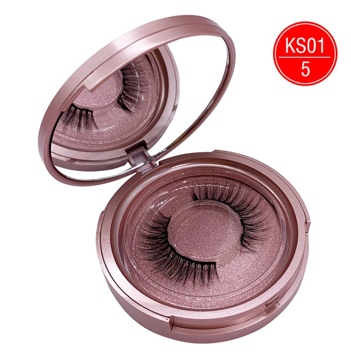 Open compact case with false eyelashes on a white background, featuring the brand 'KS'.