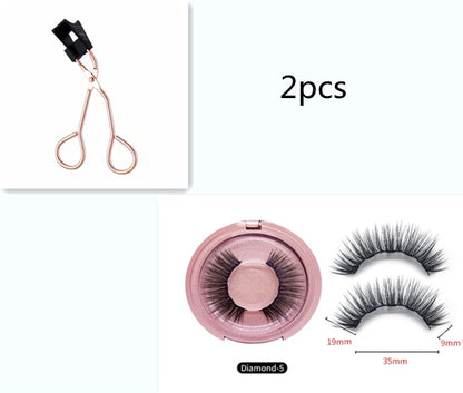 Set of false eyelashes with a pink case and clip on a white background