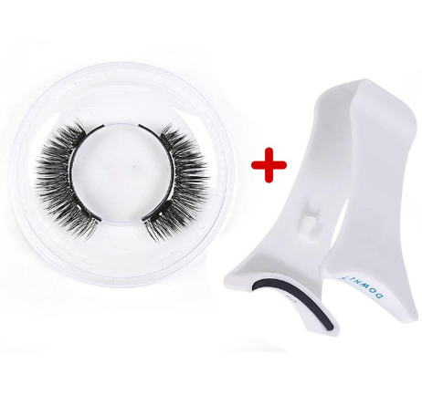 False eyelashes with a white holder and a white tool on a white background